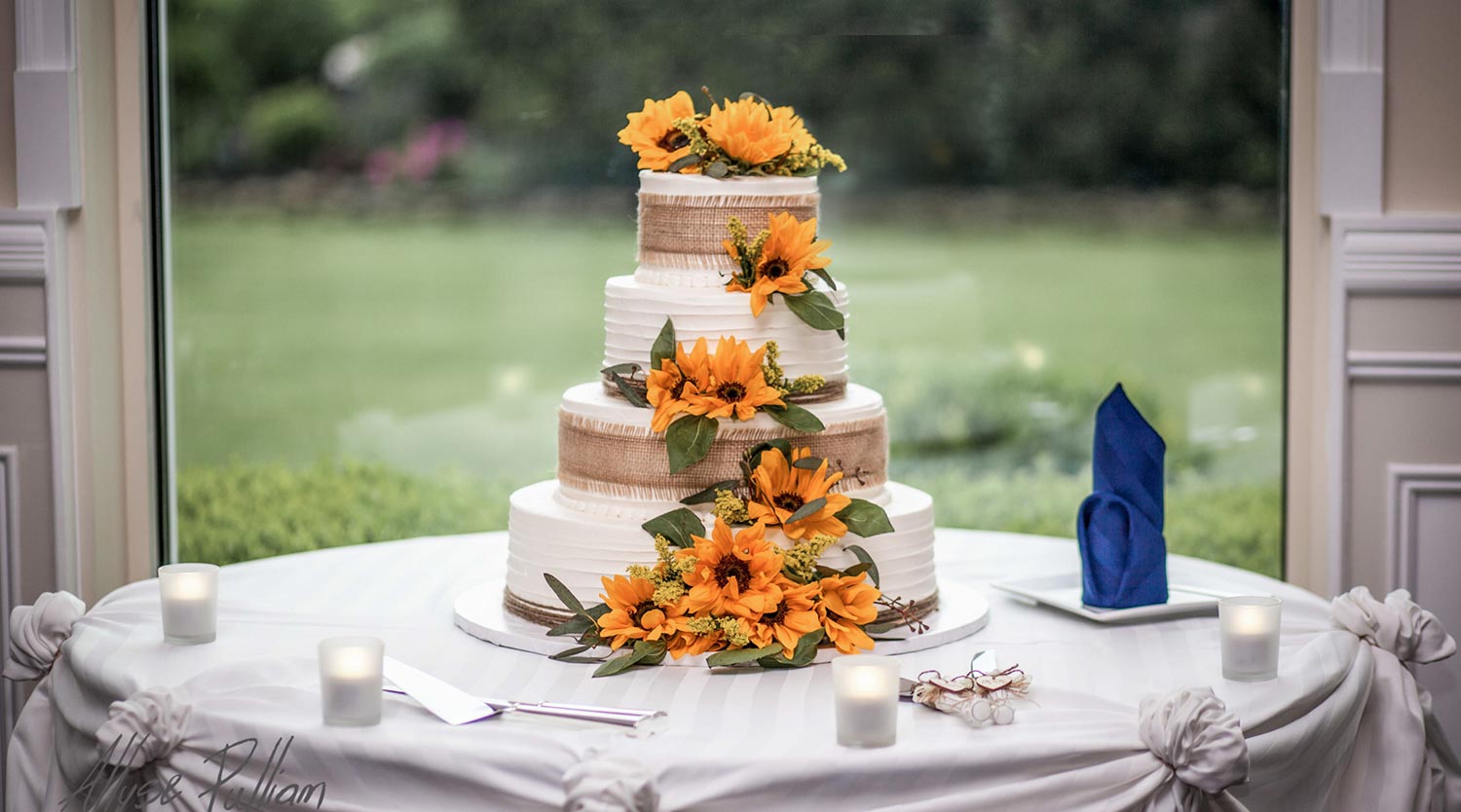 Photo: four tier Fall wedding cake with burlap and sunflowers