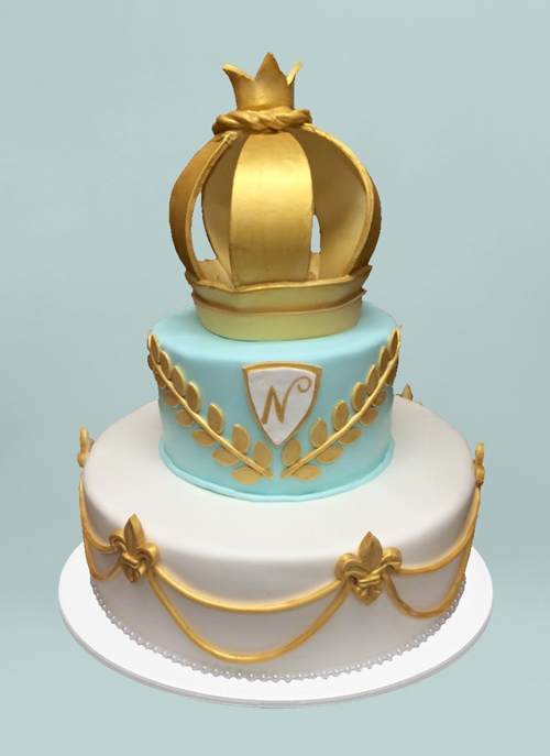 Photo: clean fondant 2 tier cake with gold leaves and crown on top tier