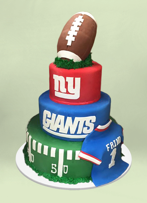Photo: 4 tier ny giants cake with fondant jersey and football shaped top tier