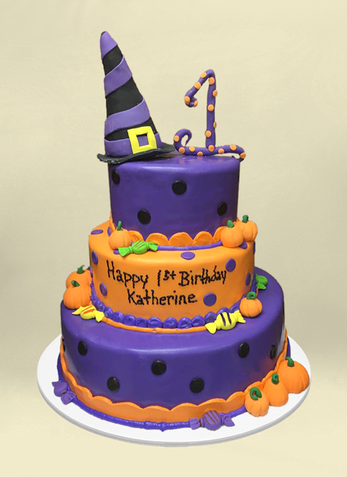 Photo: purple and orange fondant tiers with dimension pumpkins and witch hat