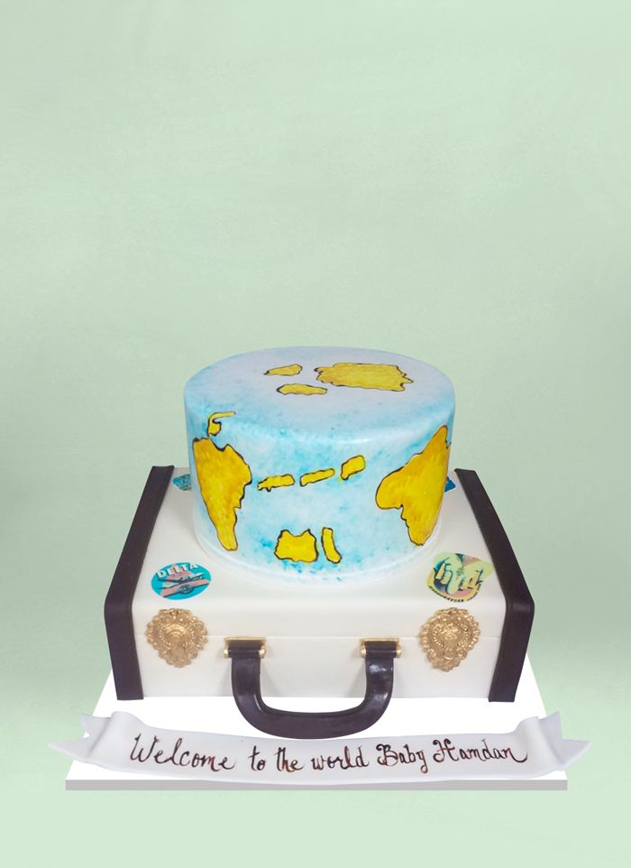 Photo: suitcase and world fondant cake