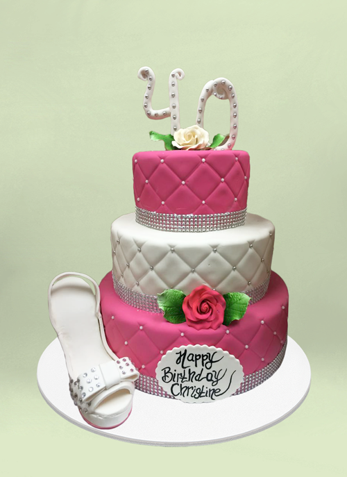 Photo: fondant cake with cushion pattern and dimentional shoe and flowers