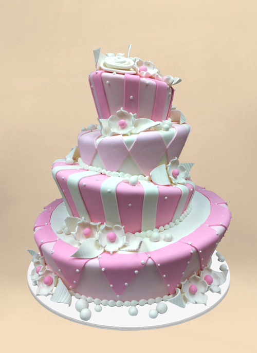 Photo: pink and white fondant patterned 4 tier topsy cake