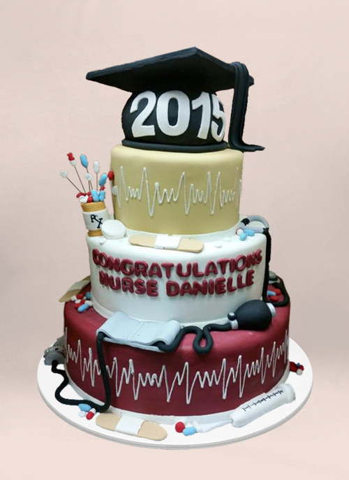 Photo: 4 tier fondant cake with dimensional grad cap and medical objects all around