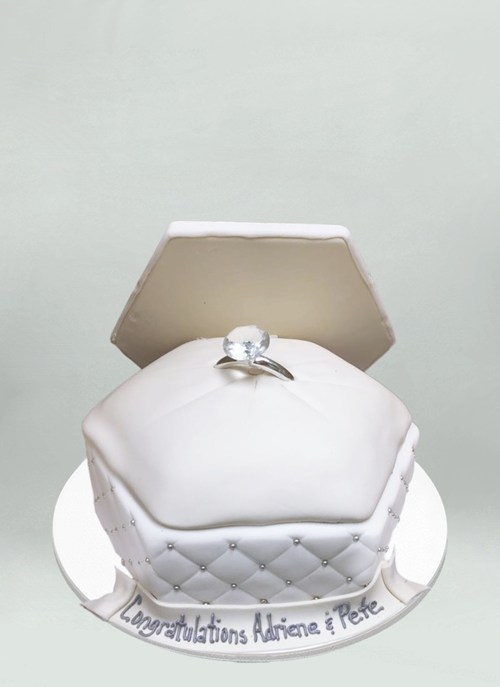 Photo: large white ring box open with large diamond ring