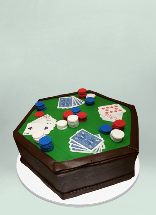 Photo: frosted octagonal cake with fondant playing cards and poker chips