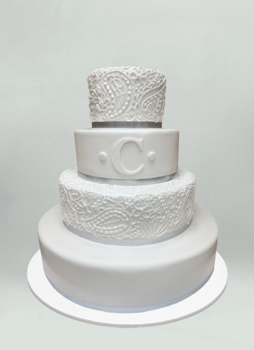 Photo: white fondant cake with detail white paisley piping