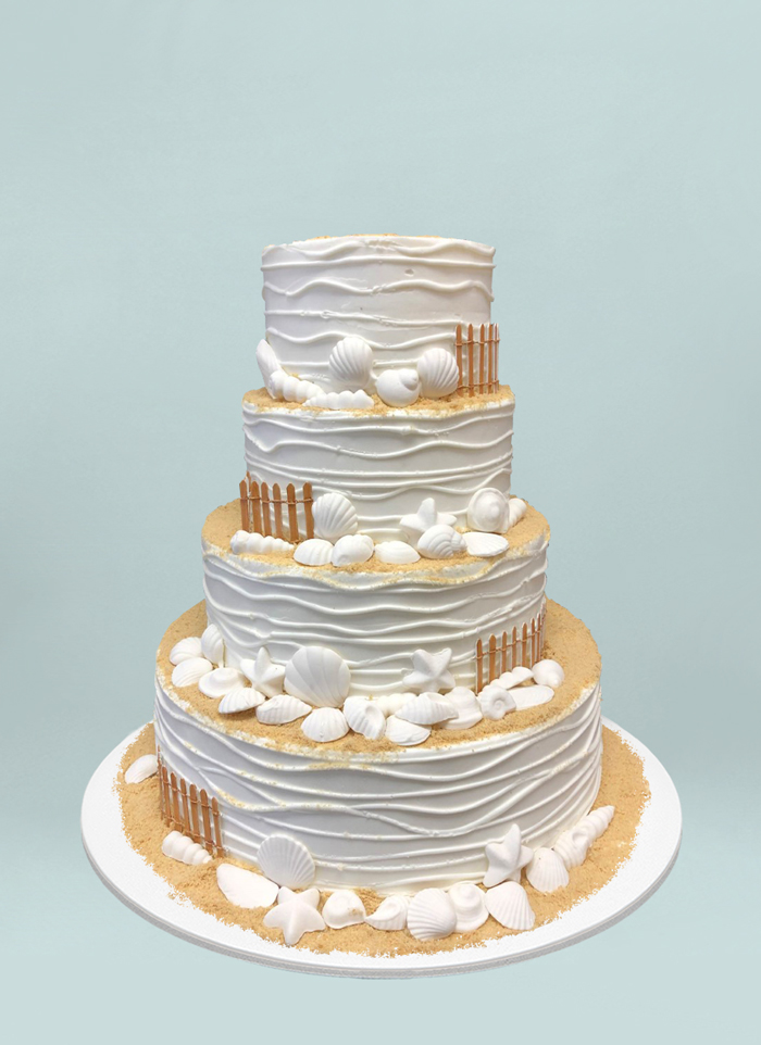 Photo: four tiered beach themed cake with fondant shells
