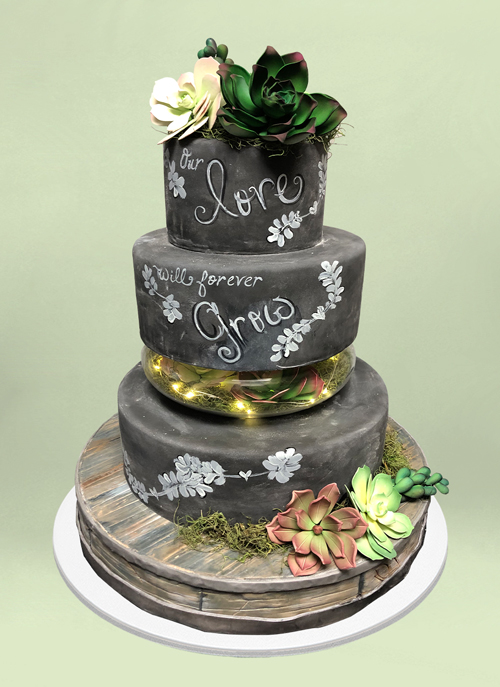 Photo: four tiered chalkboard themed cake with