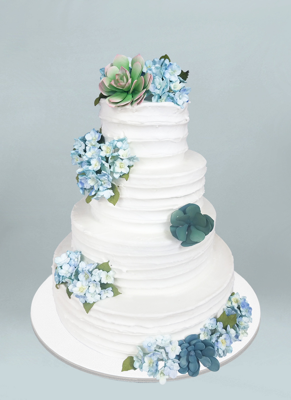 Photo: white cake with ssucculent sugar flowers