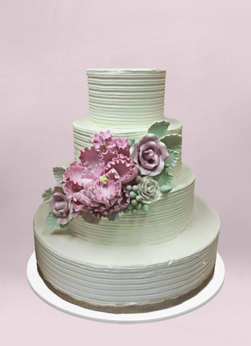Photo: off white comb texture cake with rustic pink and green Bouquet on middle tier